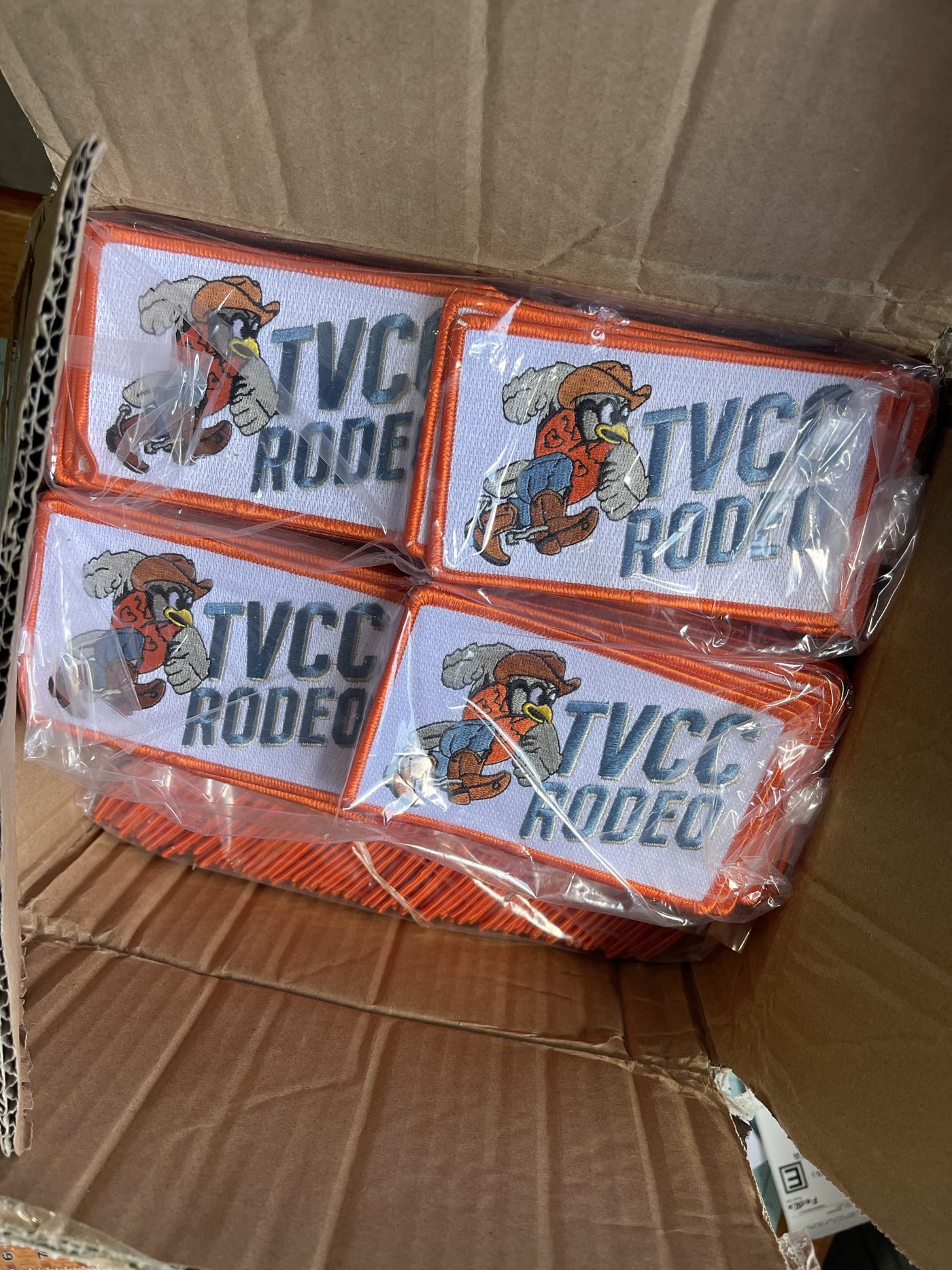 A box of TVCC Rodeo patches ready to ship